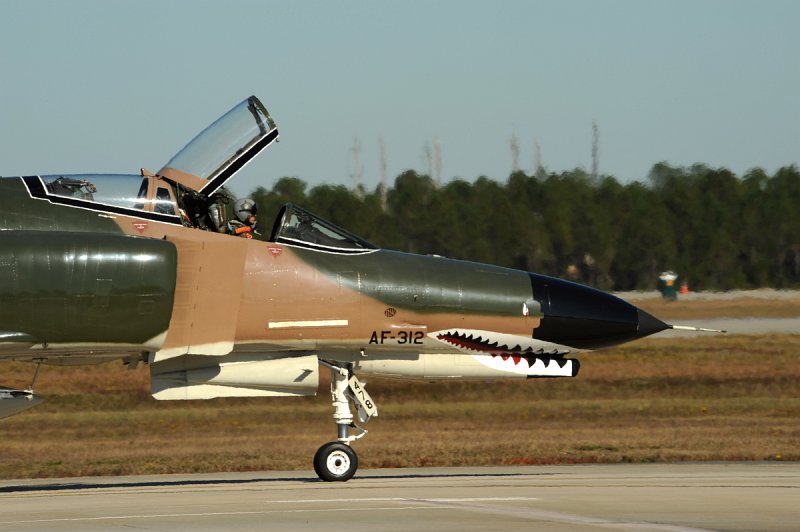 GD DSC_4254.JPG - QF-4E Phantom II, serial # 72-1478, of the 82nd Aerial Targets Squadron (ATRS), 53rd Weapons Evaluation Group (WEG) at Tyndall AFB, FL. This aircraft participates in the popular USAF 'Heritage Flight' program and wears a magnificent Southeast Asia paintscheme, full colored sharksmouth and tail markings for the Commander of the 82nd ATRS. The jet is being piloted by the 82nd ATRS Commander, LtC. JD 'Bare' Lee. This aircraft has been returned to service after being modified into a drone by BAE Systems in Mojave, CA. The jet continues to serve the AF's needs as a full-scale aerial target and will eventually be destroyed by missiles etc. while being flown by a remote operator on the ground. Photographed on 17 Nov. 2008.  © 2008 Greg L. Davis, Aviation Photojournalist  www.focalplaneimagery.com